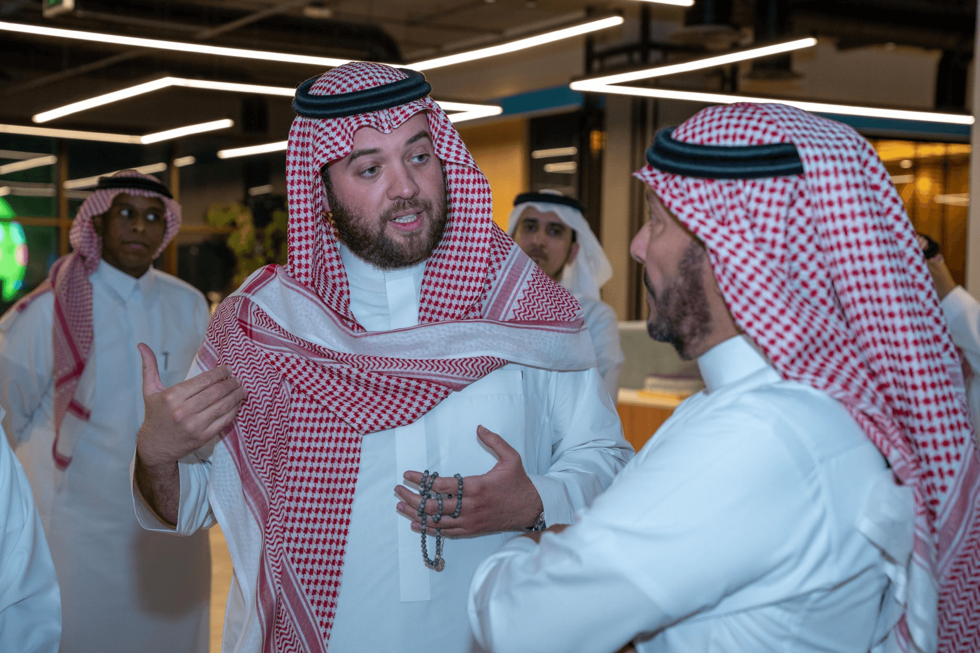 Saudi and Middle Eastern business professionals collaborating in a modern office